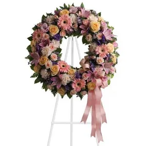 Ir al producto: Corona funeraria de gerberas rosas liliums y claveles