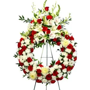 Ir al producto: Corona funeraria de rosas claveles crisantemos y orquideas