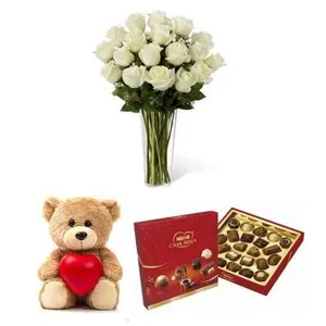 Ir al producto: Ramo de 10 rosas blancas con bombones y osito de peluche