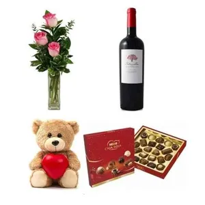 Ir al producto: 3 rosas rosadas con osito vino y bombones